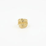 Bague ajustable Ipsē modèle Ambera en acier inoxydable doré avec un motif de deux feuilles exotiques.