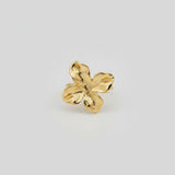Bague ajustable Ipsē en acier inoxydable doré avec un motif de fleur texturé, résistante à l'eau.