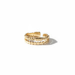 Bague Ipsē Nacara ajustable en acier inoxydable doré, composée de deux rangs, l'un perlé et l'autre barbelé.