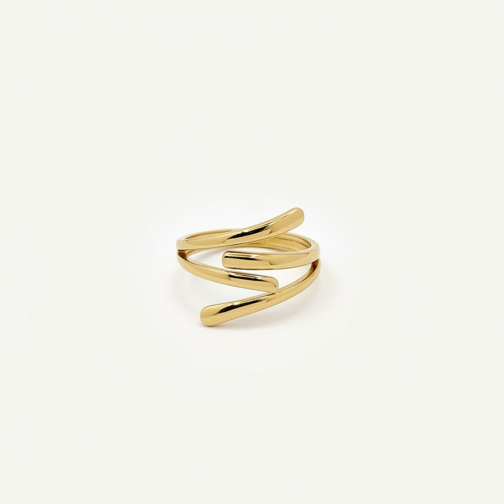Bague Ipsē Pesca ajustable en acier inoxydable doré aux lignes graphiques modernes et minimalistes